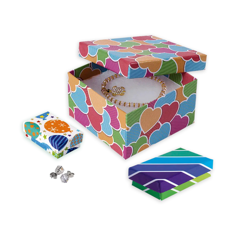 Variedad de cajas de regalo para joyería de la línea Fancy, mostrando diferentes diseños y colores vibrantes.