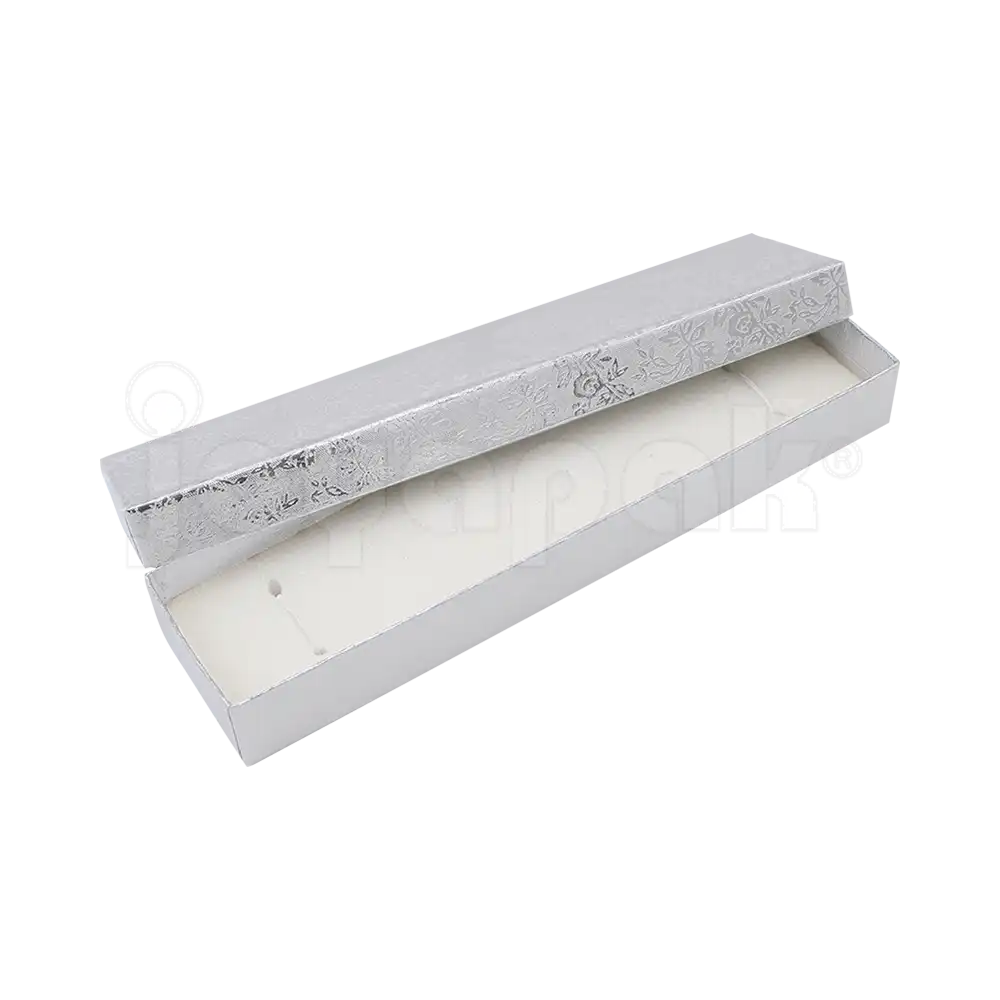 nterior de la caja Fiore para pulsera mostrando el cojín de terciopelo con elásticos para sujetar la pieza.