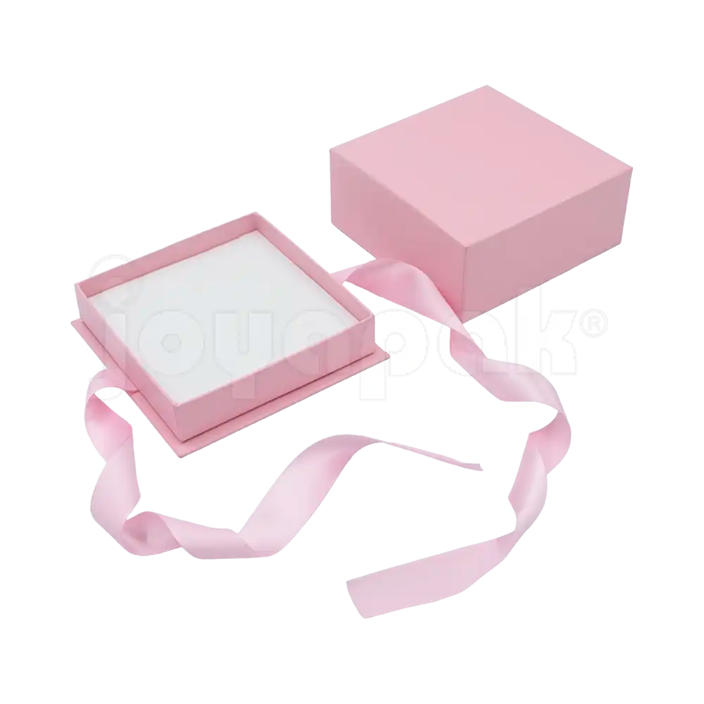 Caja Milán para juego de cartón rígido color Rosa PK abierta con base blanca.