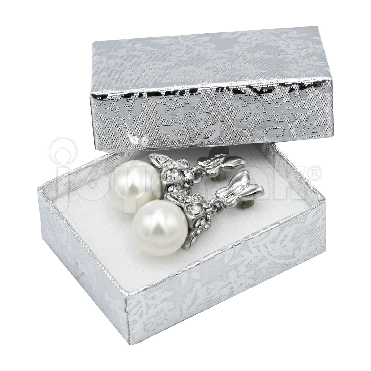 Broqueles de oro presentados dentro de la caja Fiore plateada mini para mostrar tamaño y uso.