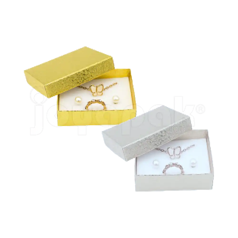 Cajas para juegos de joyería modelo Estrella Mediana en colores dorado y plateado sobre fondo blanco.