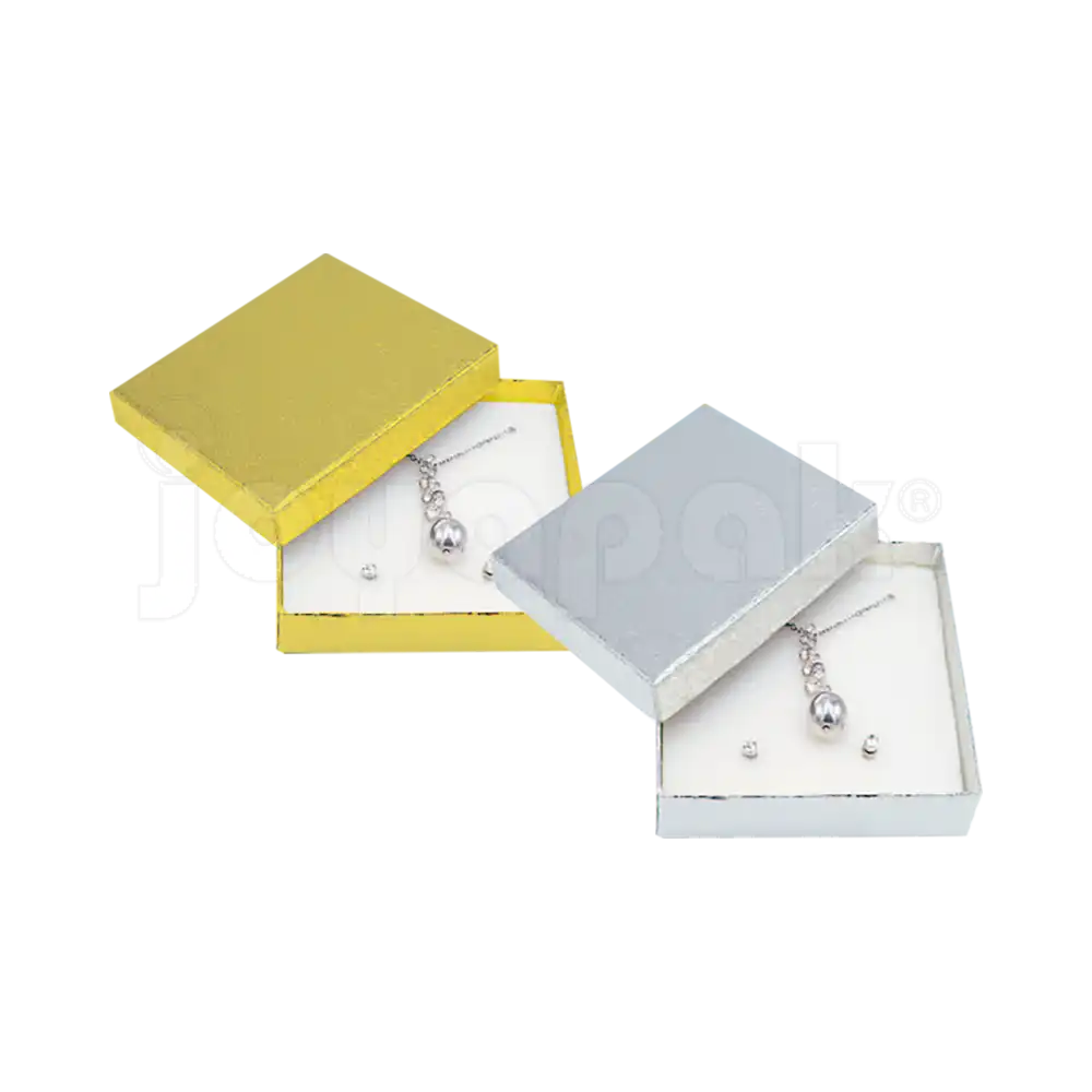 Cajas cuadradas para juego de joyería modelo Estrella en acabados dorado y plateado, de Joyapak.