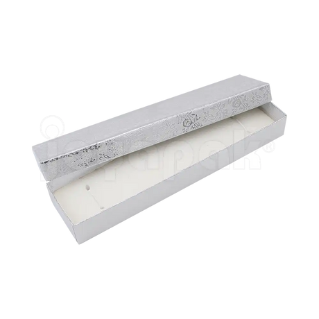 nterior de la caja Fiore para pulsera mostrando el cojín de terciopelo con elásticos para sujetar la pieza.