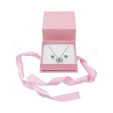 Caja Milán para aretes de cartón rígido texturizado color Rosa PK cerrada.