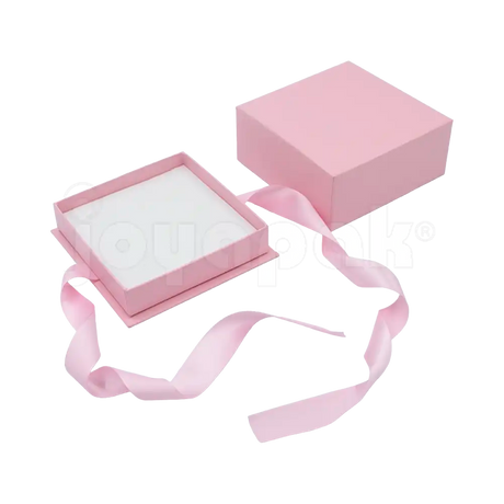 Caja Milán para juego de cartón rígido color Rosa PK abierta con base blanca.