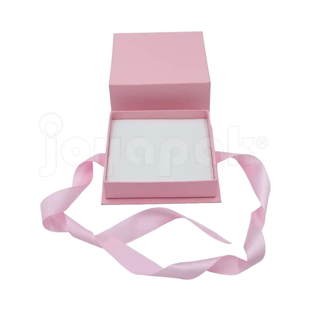 Caja Milán para juego de cartón rígido texturizado color Rosa PK abierta de frente.