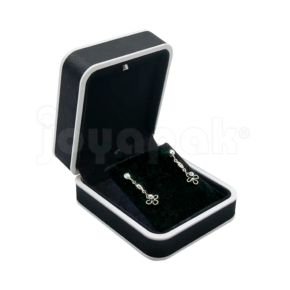 Estuche de lujo bicolor negro con bordes blancos y luz LED para aretes, abierto mostrando inserto negro de terciopelo vacío iluminado.