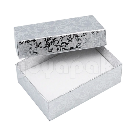 Interior de la caja Fiore mediana con inserto de terciopelo y ranuras para colocar un juego de aretes y dije.